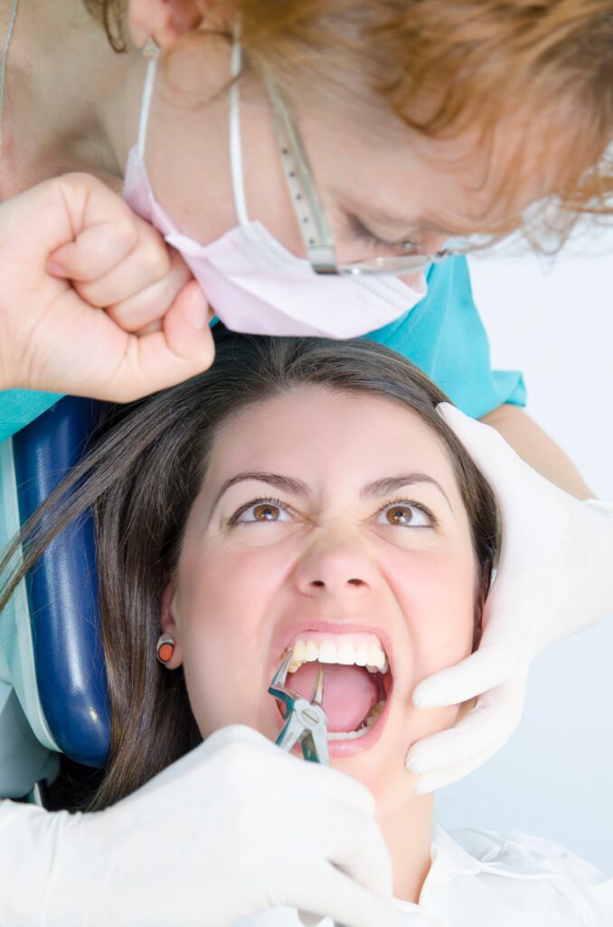 Dentist anxiety – nervous patient in the dental chair